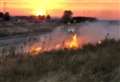 Campers jump to the rescue to put out grass fire