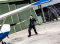 Record-breaker lugs aeroplane... with his ears