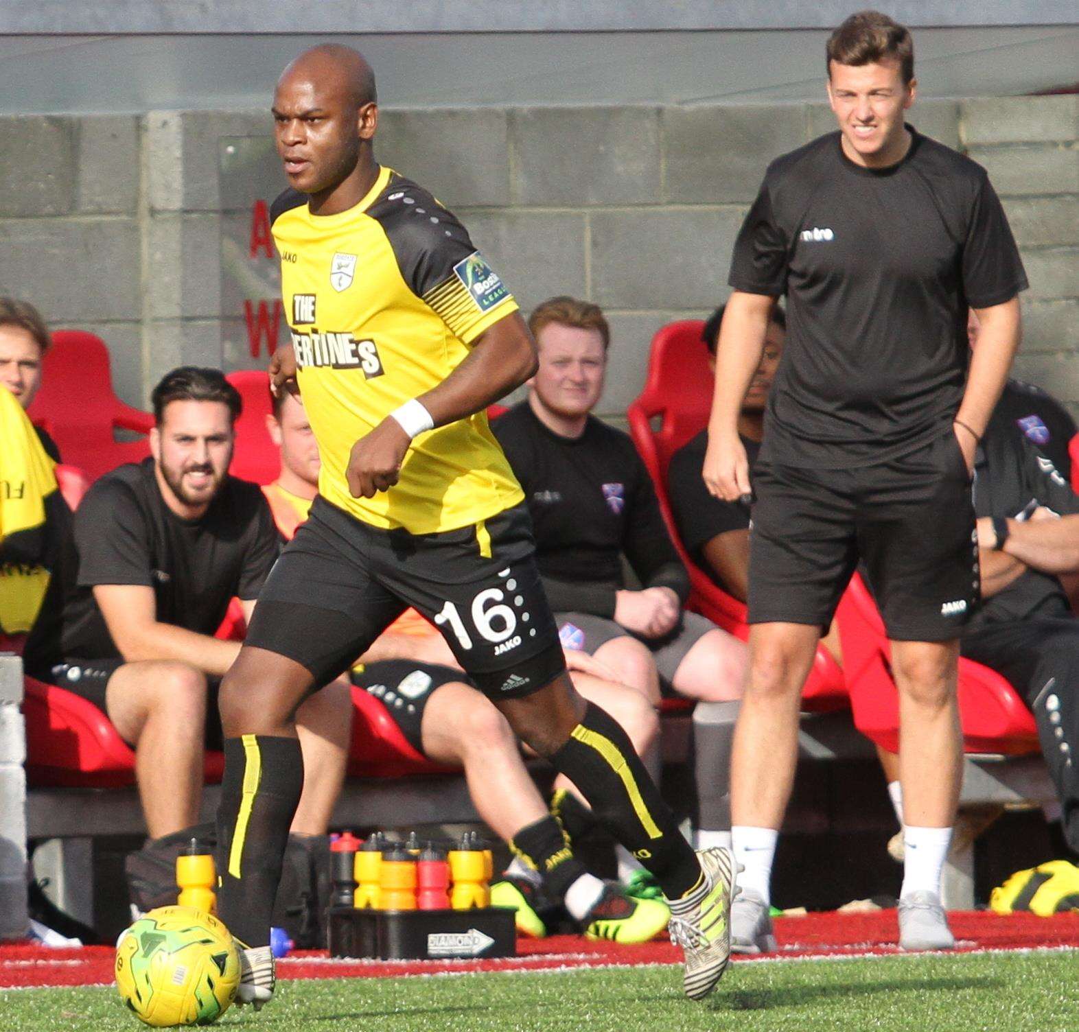 Margate striker Leroy Lita makes a break against Worthing while joint boss Mike Sandmann looks on Picture: Don Walker