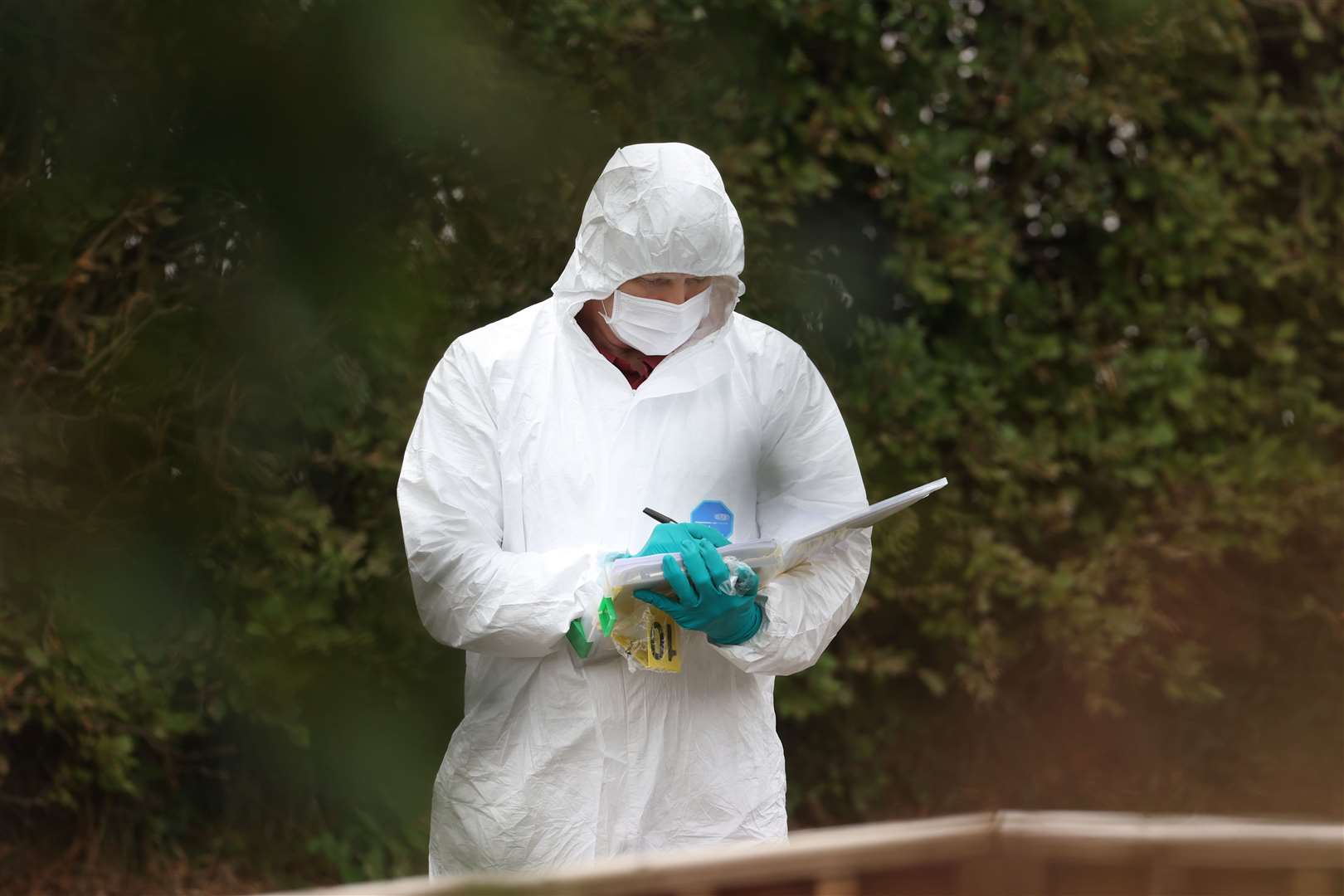 Forensic officers at the Swanns Bridge Glamping site after a woman was stabbed to death (Liam McBurney/PA)