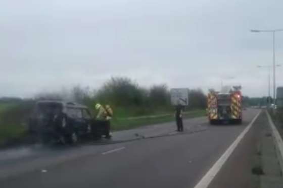 Fire crews tackle the car fire on Thanet Way