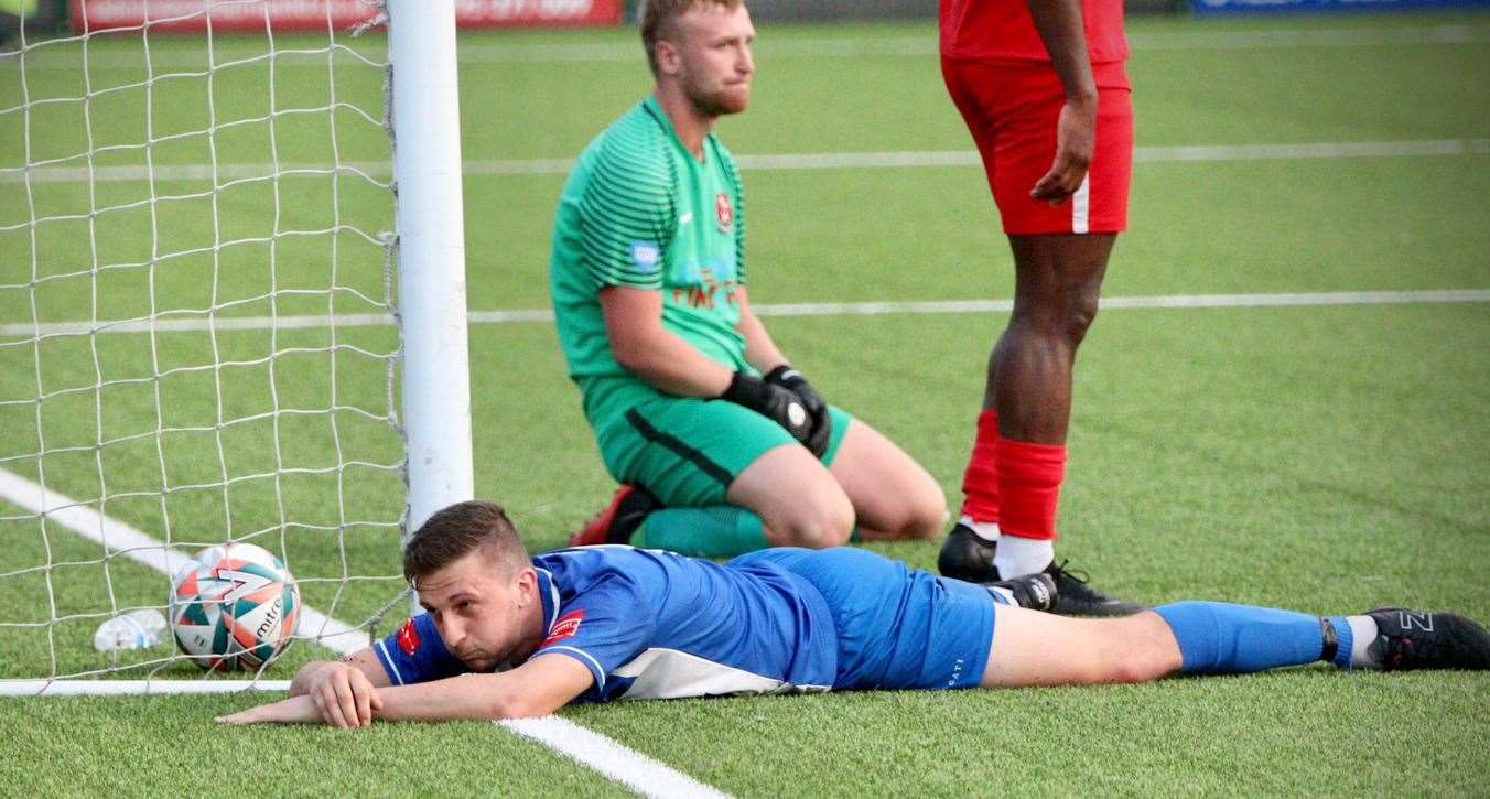 Herne Bay striker Kane Rowland scores past a helpless Tunbridge Wells keeper George Bentley. Picture: James Aylward