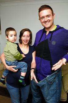 Michael Hutchinson with son Harry and wife Claire, and a pair of his old jeans