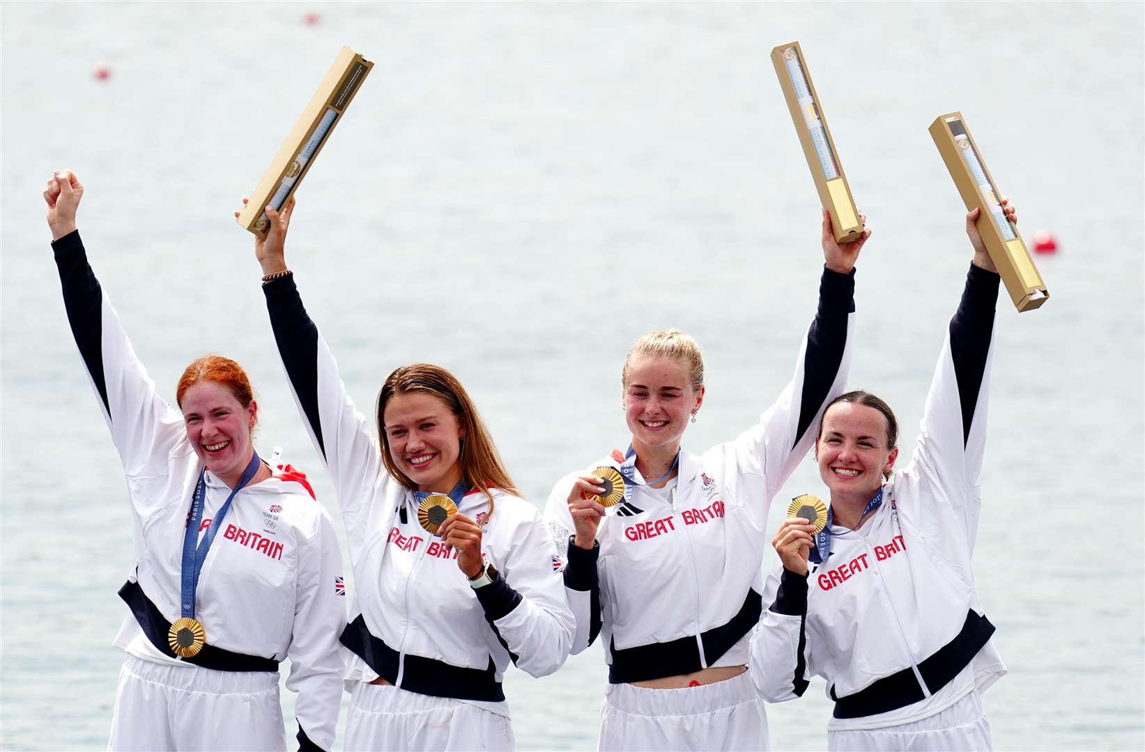 Great Britain’s Lauren Henry, Hannah Scott, Lola Anderson and Georgie Brayshaw celebrate with their gold medals following the Women’s Quadruple Sculls Final (Mike Egerton/PA)