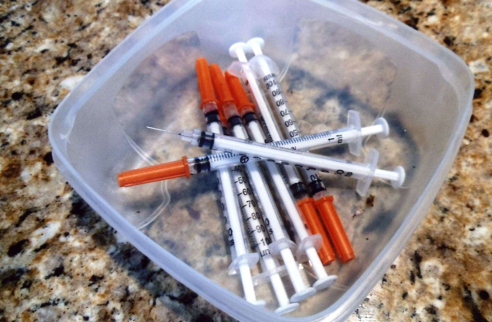 His house was strewn with so many used hypodermic needles police stopped their search. Stock image