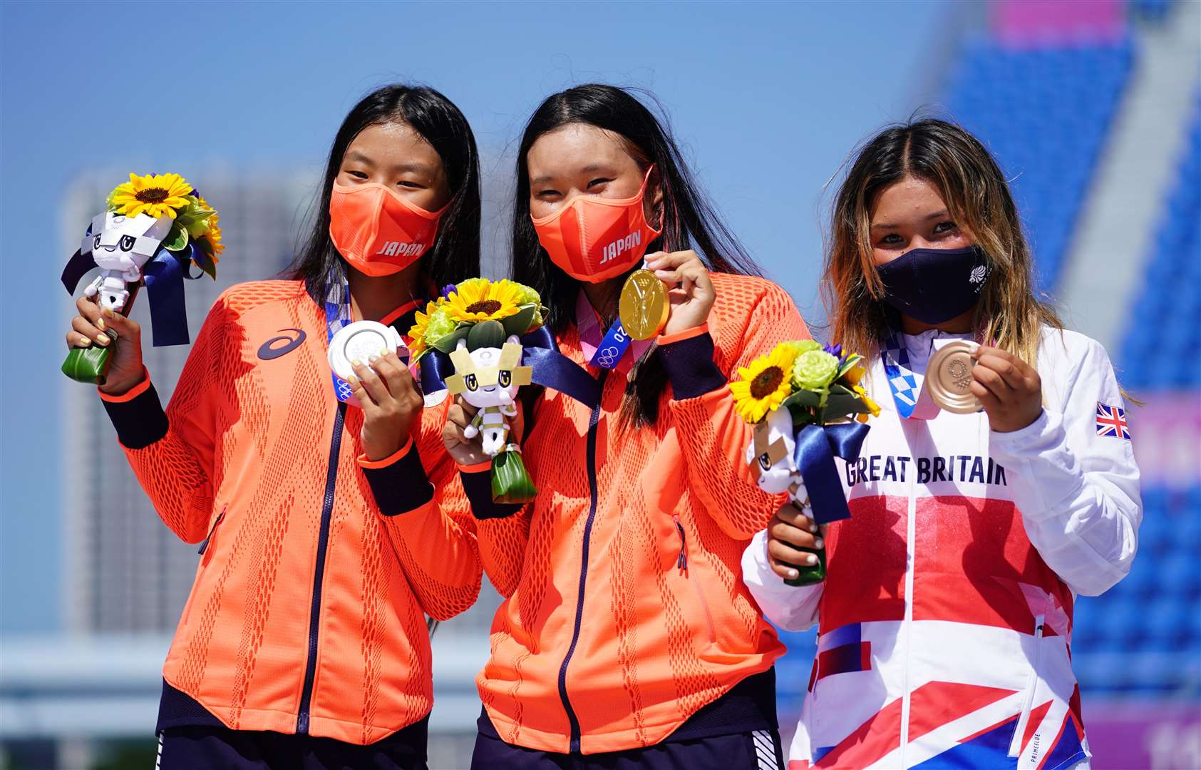 Sky Brown (right) celebrates with Japan’s Sakura Yosozumi, who won gold, and Sakura Kokona Hiraki, who won silver (Adam Davy/PA)