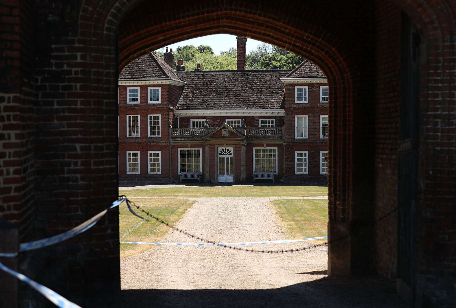 Police tape at the entrance to Lullingstone Castle in Eynsford, Kent, where a man has died after reports of a disturbance in the grounds on Thursday evening.