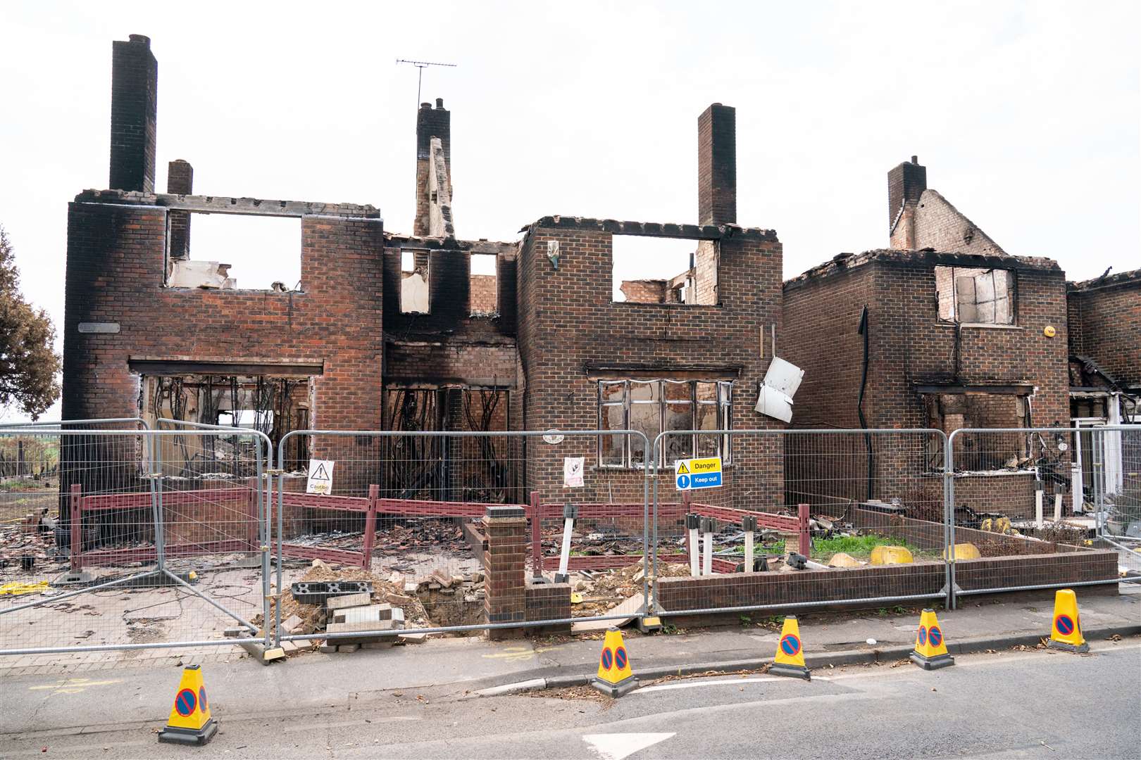 Unprecedented temperatures in 2022 led to a grassfire destroying dozens of properties in Wennington, east London (Dominic Lipinski/PA)