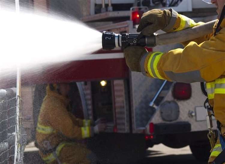 Crews from four fire engines are tackling the blaze. Stock image