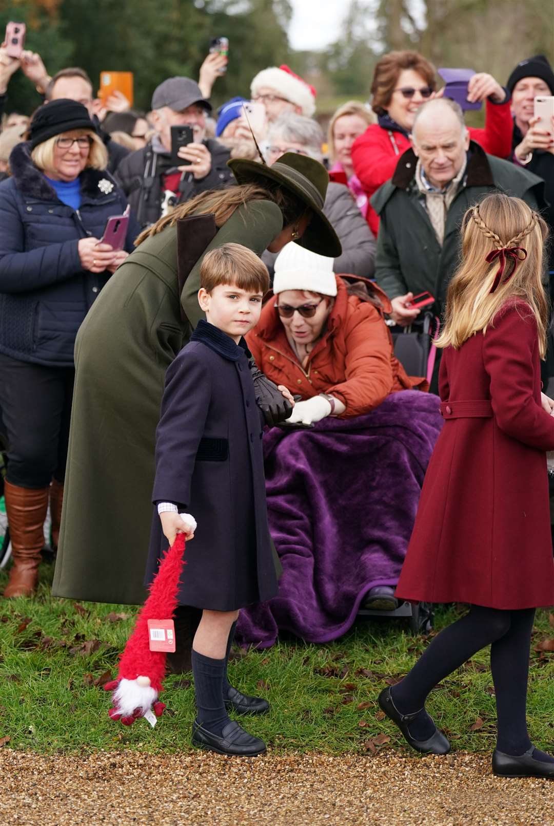 Louis holding one of the gifts he was given by royal fans (Joe Giddens/PA)