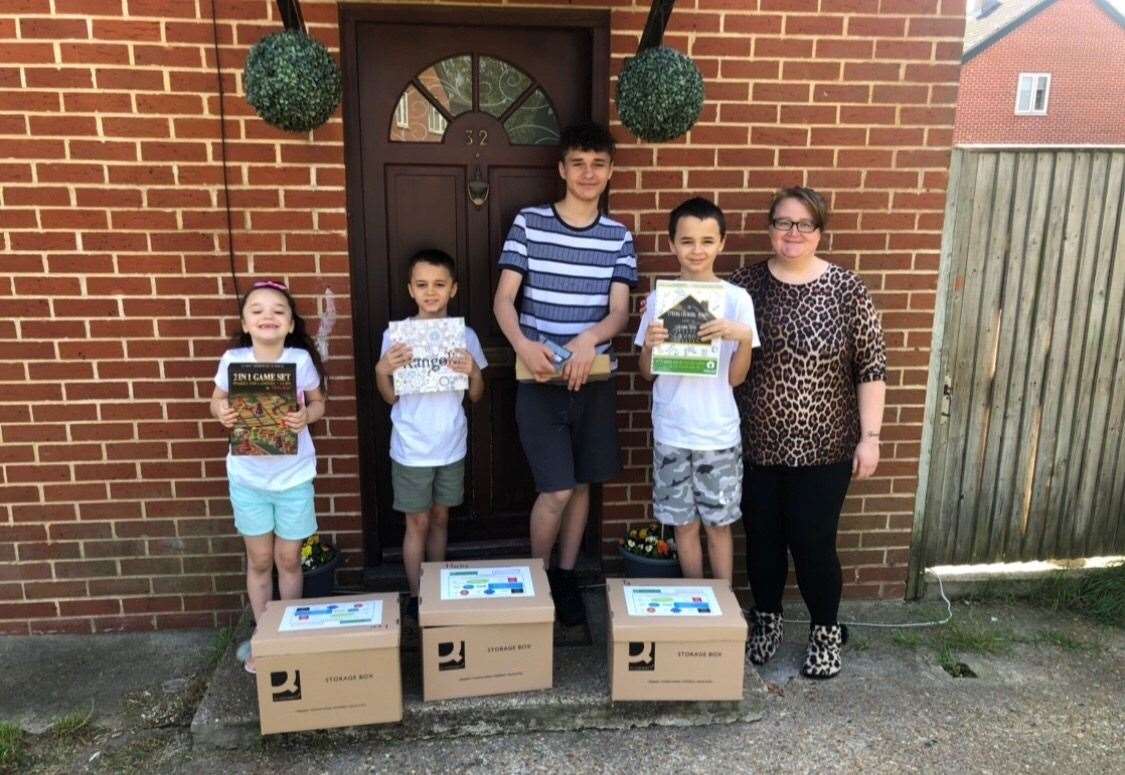 Katie Tilcock and her children with their wellbeing packages