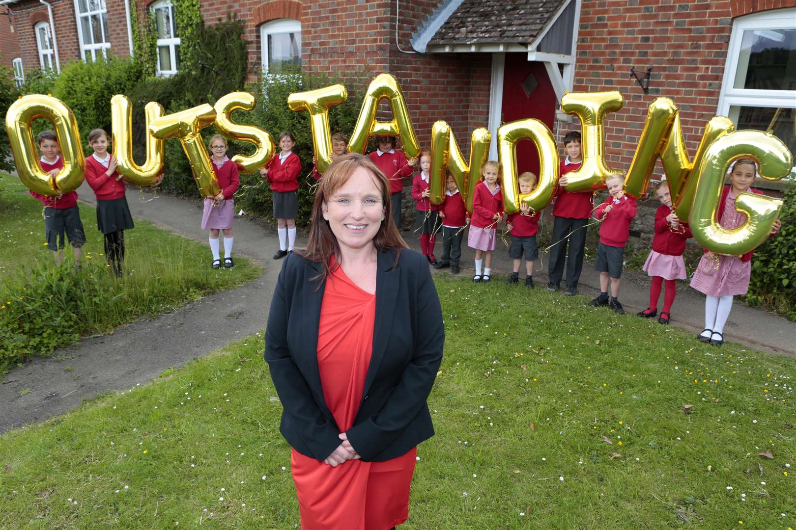 Head Ruth Powell celebrates the Ofsted judgement with pupils