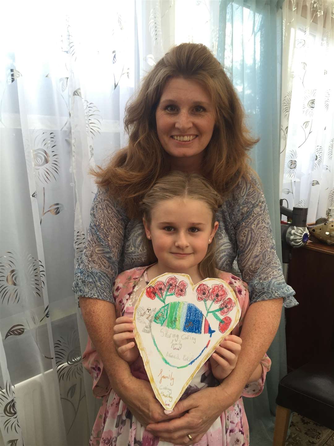 Connie and her mum Theresa Roberts-McNeil with her badge design