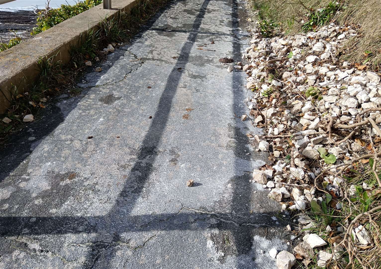 Rocks and debris have started falling onto the footpath. Picture: Nik Mitchell