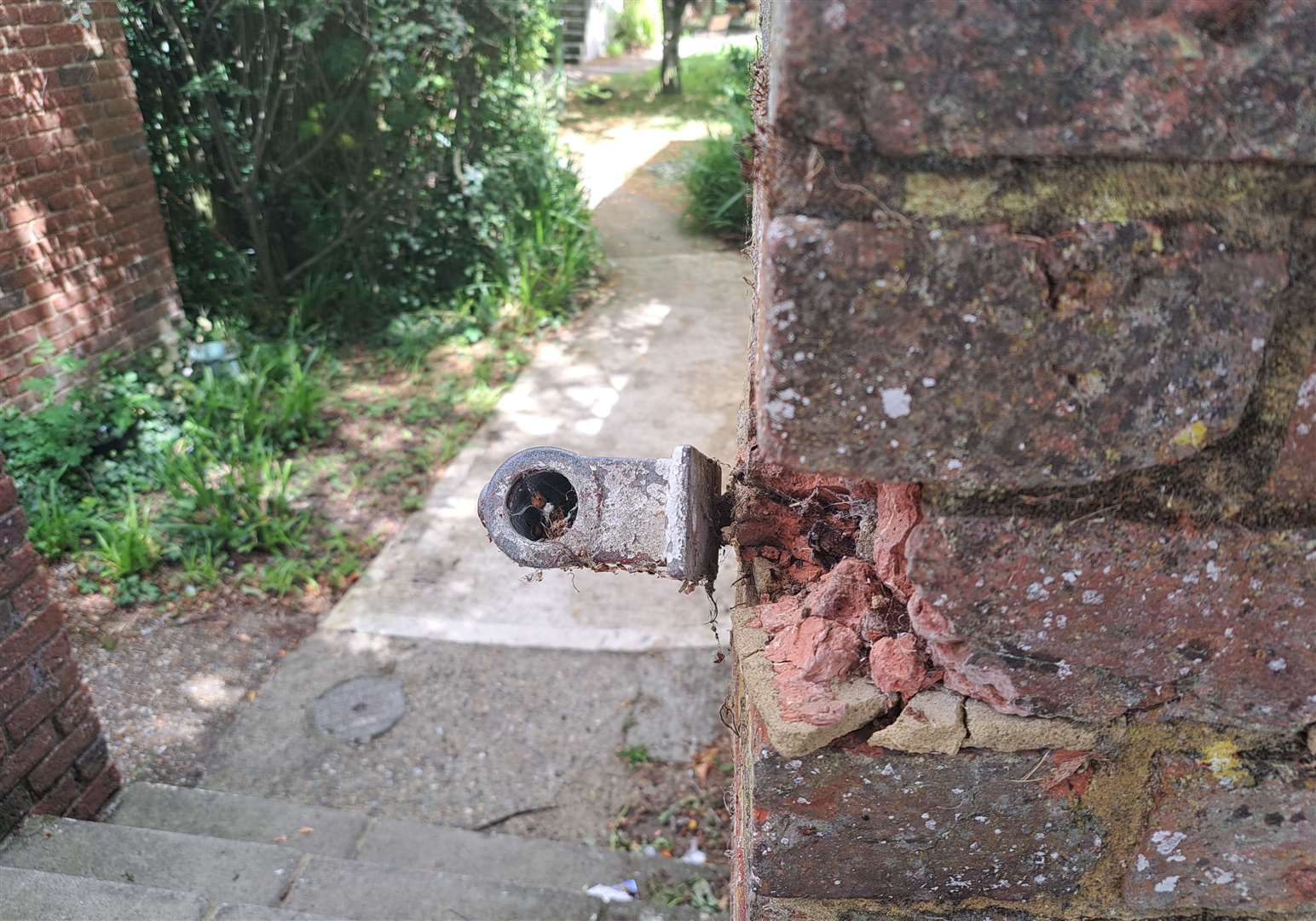 A railing has been damaged on a well-used path