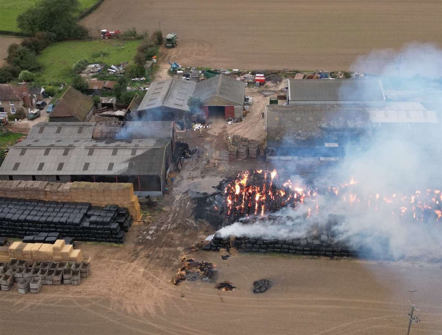 A large amount of smoke is still billowing from Elmtree farm in Sellindge. Picture: Barry Goodwin