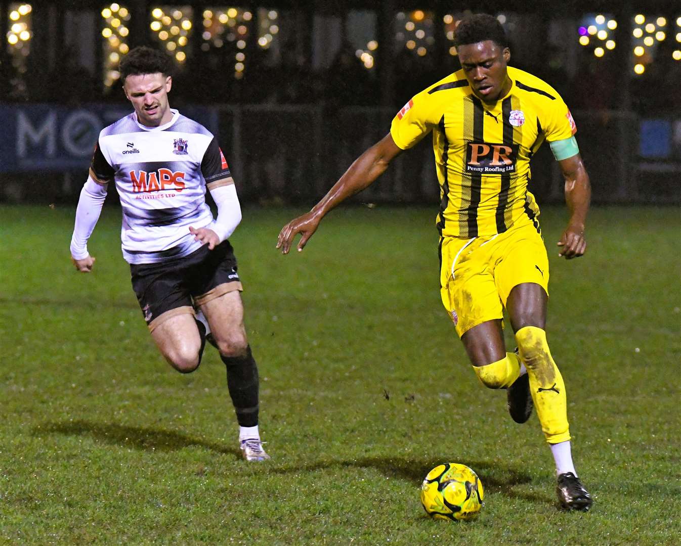 Sheppey defender Lekan Majoyegbe tries to get away from Deal substitute Wes Hennessey. Picture: Marc Richards