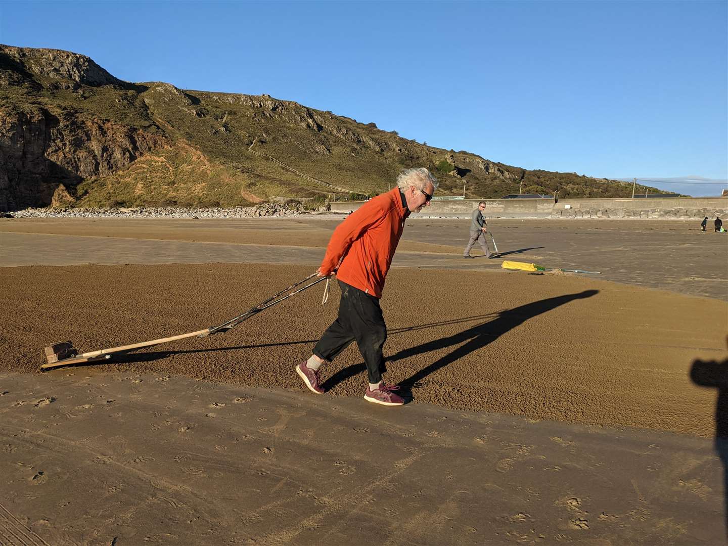 Simon Beck uses a rake and a magnetic compass to create his designs (Raed Shakman)