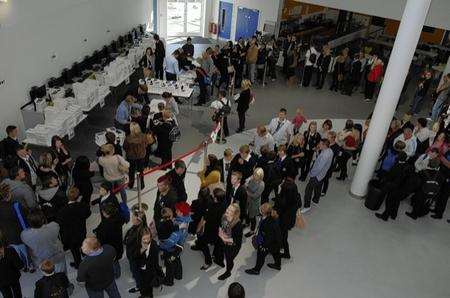 Parents and pupils que up for the iPad's at the Spires Academy