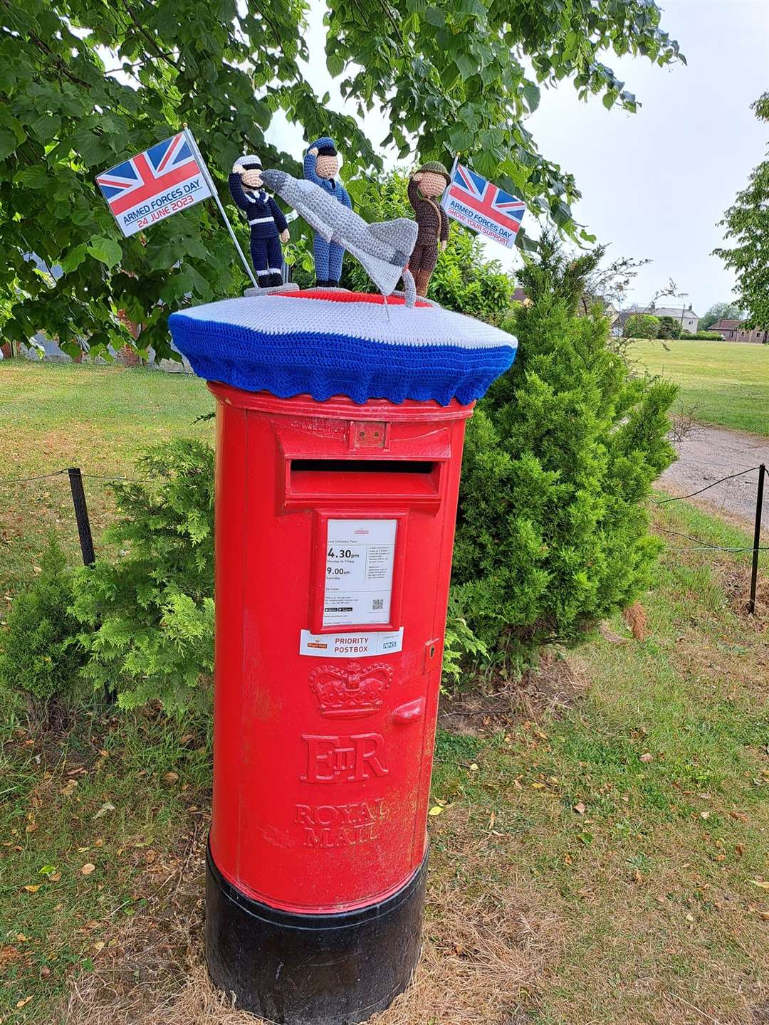 Bev Mayhew’s Armed Forces Day postbox topper features crocheted members of the armed forces (Bev Mayhew/PA)