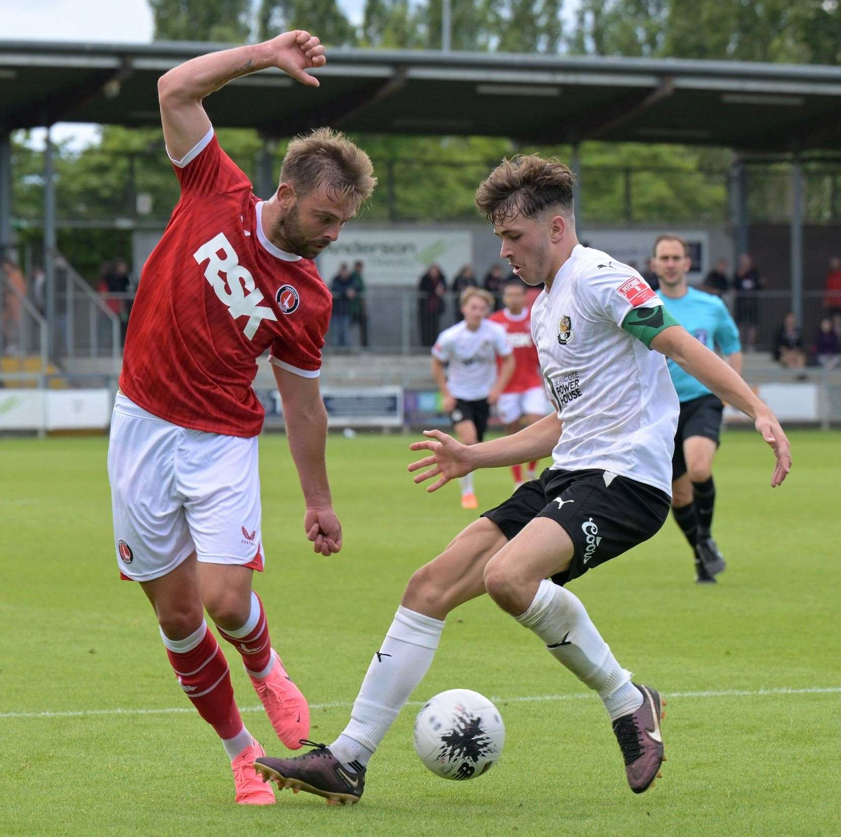 Former Darts striker Matty Godden does battle with young Dartford defender George Whitefield. Picture: Keith Gillard