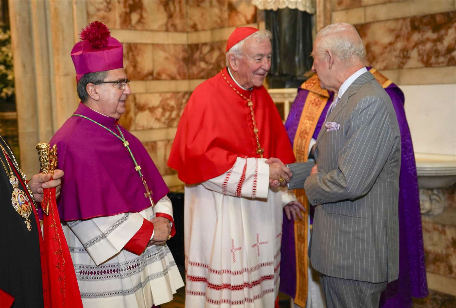 Charles is greeted by cardinal Vincent Nicholls as he arrives for the service (Arthur Edwards/The Sun/PA)