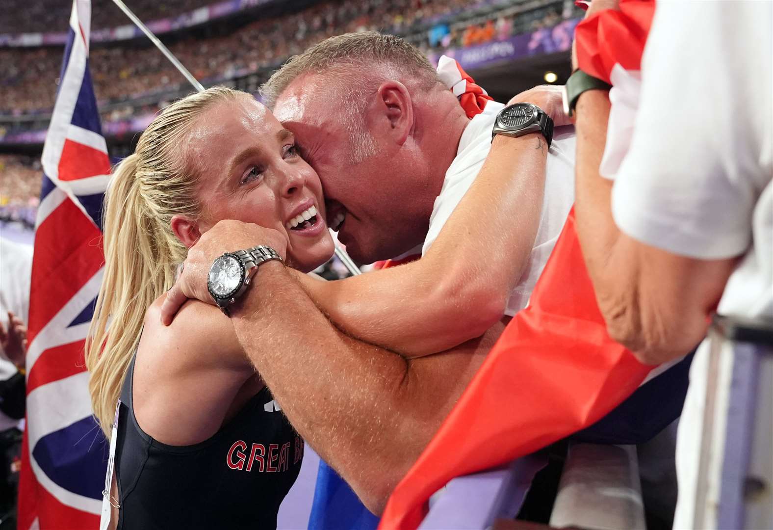 Keely Hodgkinson found and hugged her father, Dean, after the race (Martin Rickett/PA)