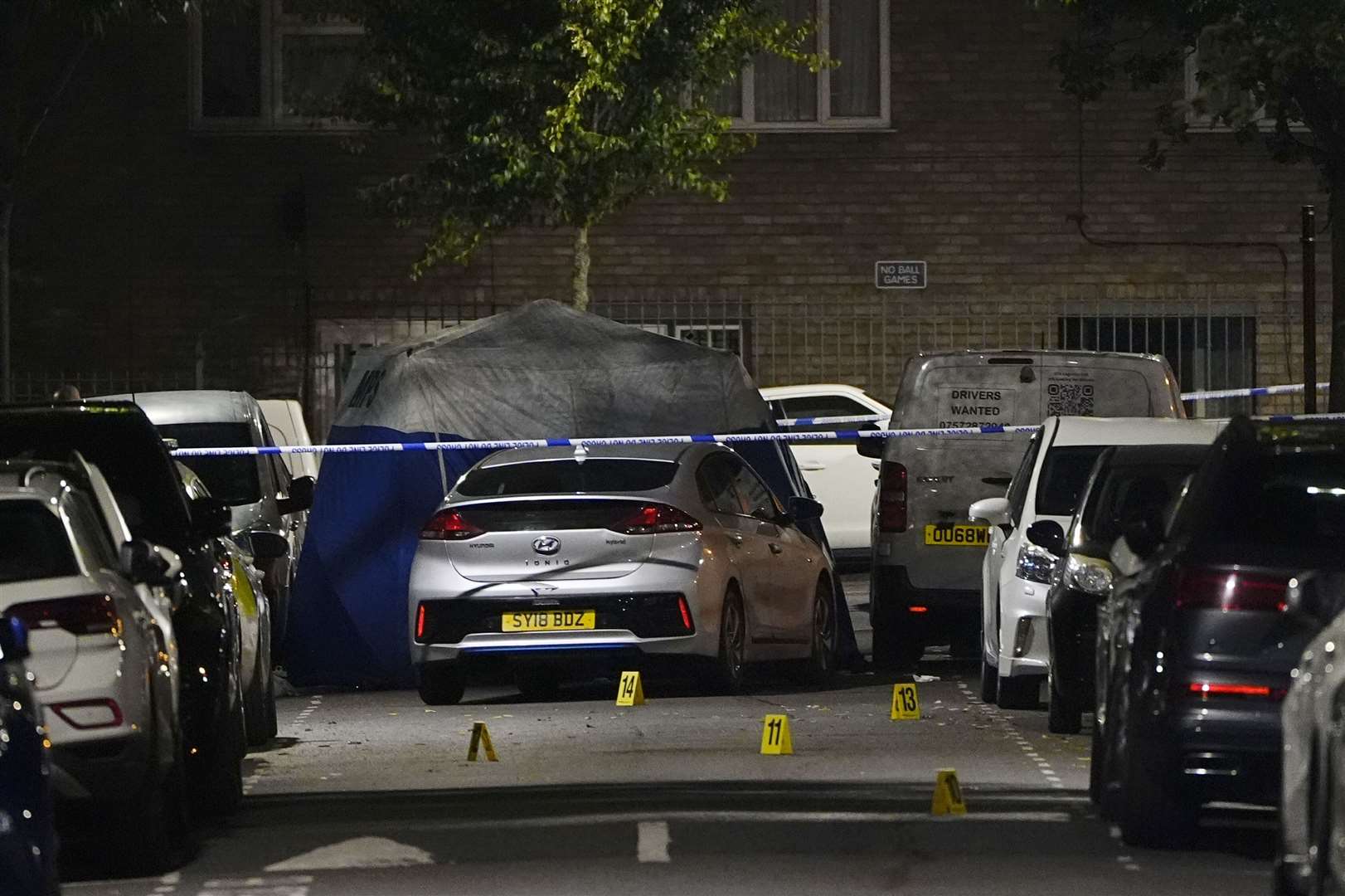 Crime scene markers on Overbury Street near the scene in Rushmore Road, Clapton, east London, after a man in his 30s was stabbed to death (PA)