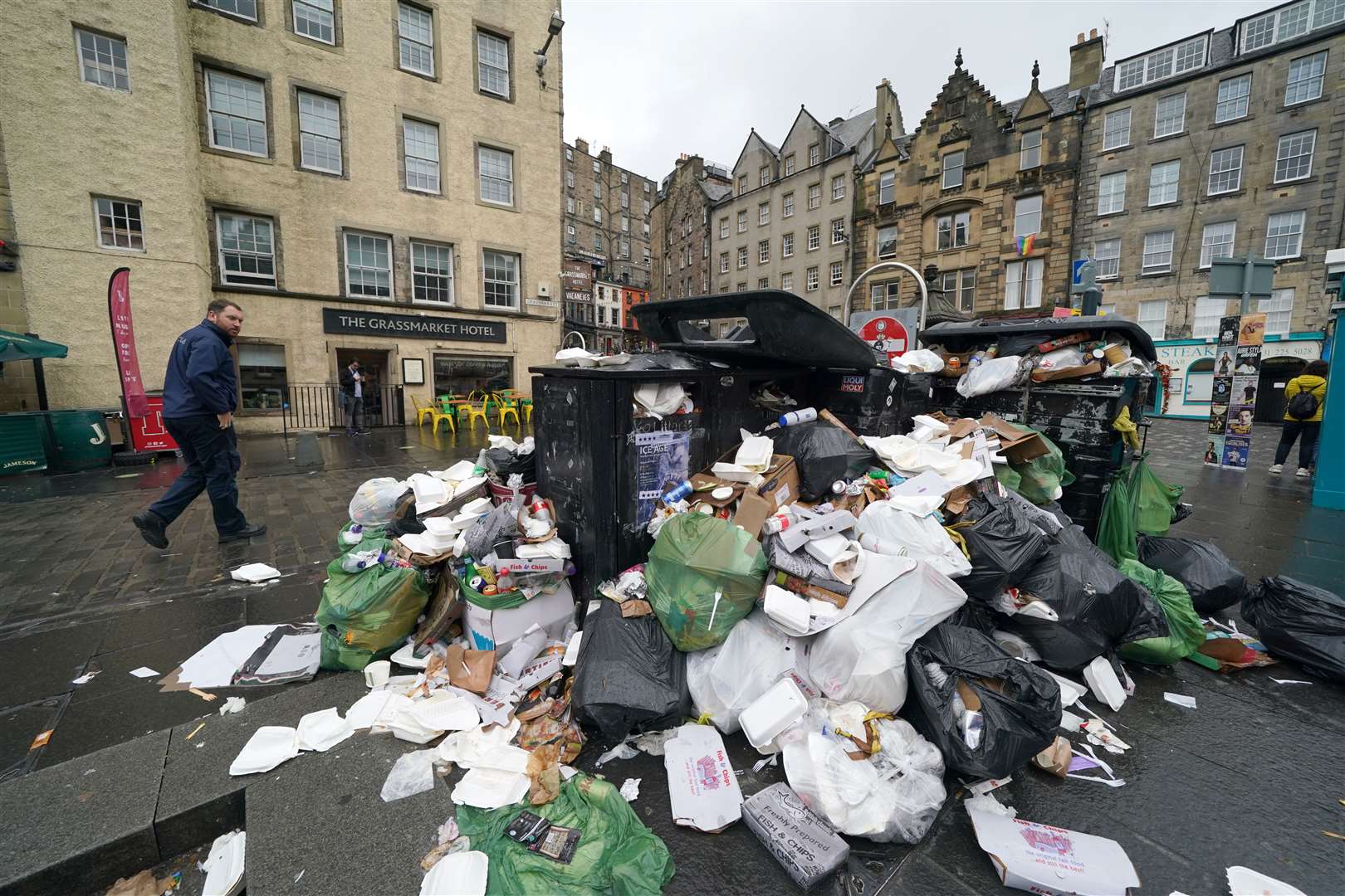 The strikes resulted in bins overflowing (Andrew Milligan/PA)