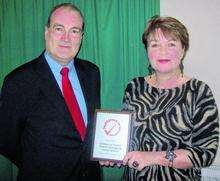 South Thanet MP Dr Stephen Ladyman presents the Investors in Volunteers award to Caroline de Costa, volunteer co-ordinator at St Peter-in-Thanet Junior School