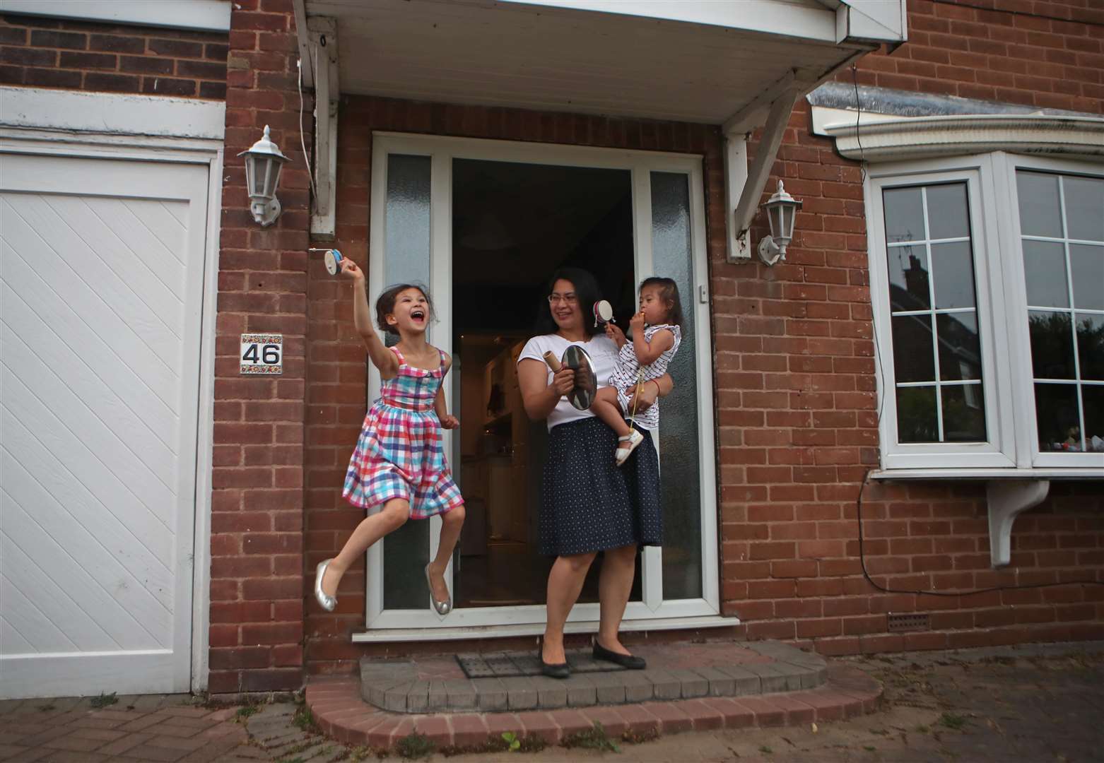 People stood on their doorsteps every Thursday at 8pm to clap, cheer and bang pots and pans to show their support for those on the front line of the pandemic (Danny Lawson/PA)