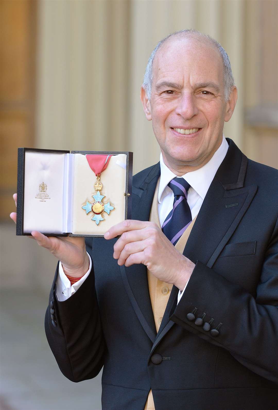 Loyd Grossman after being made a CBE (John Stillwell/PA)