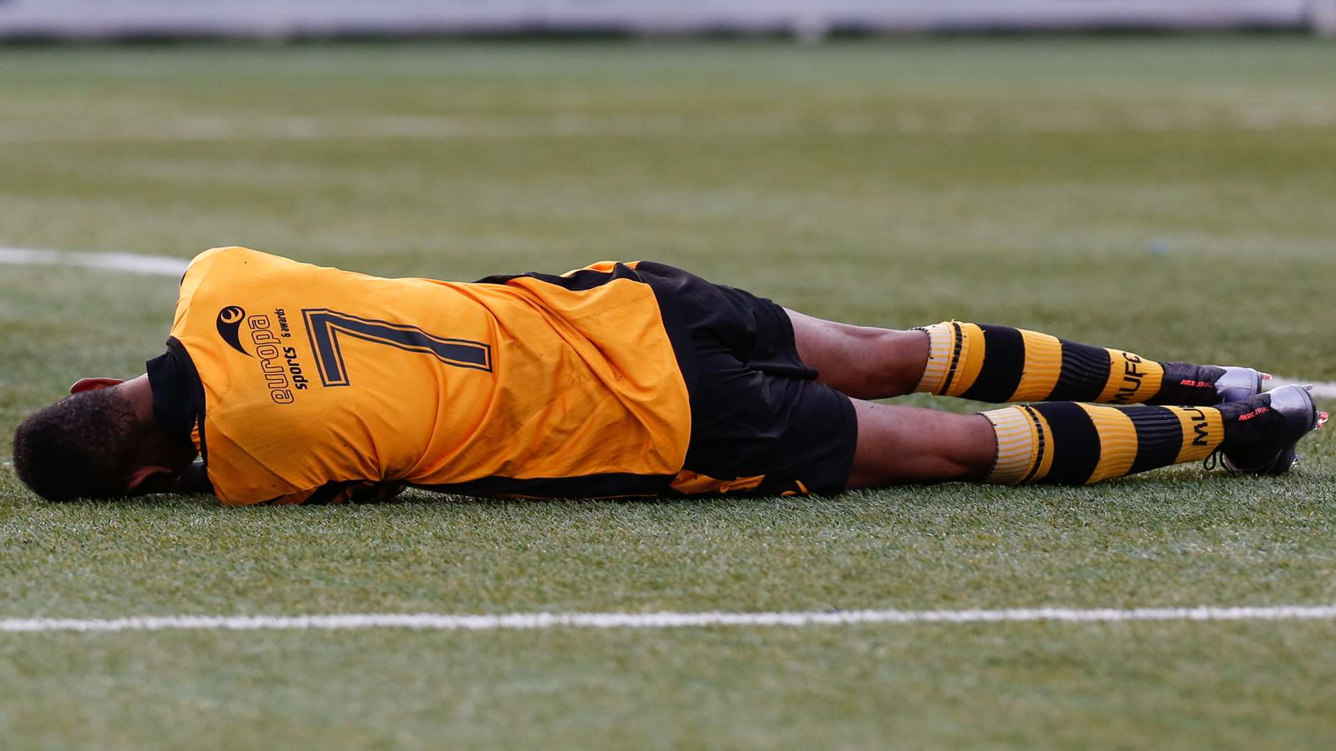 Charles Banya out cold following a challenge by Basingstoke keeper Aaron Howe Picture: Matthew Walker