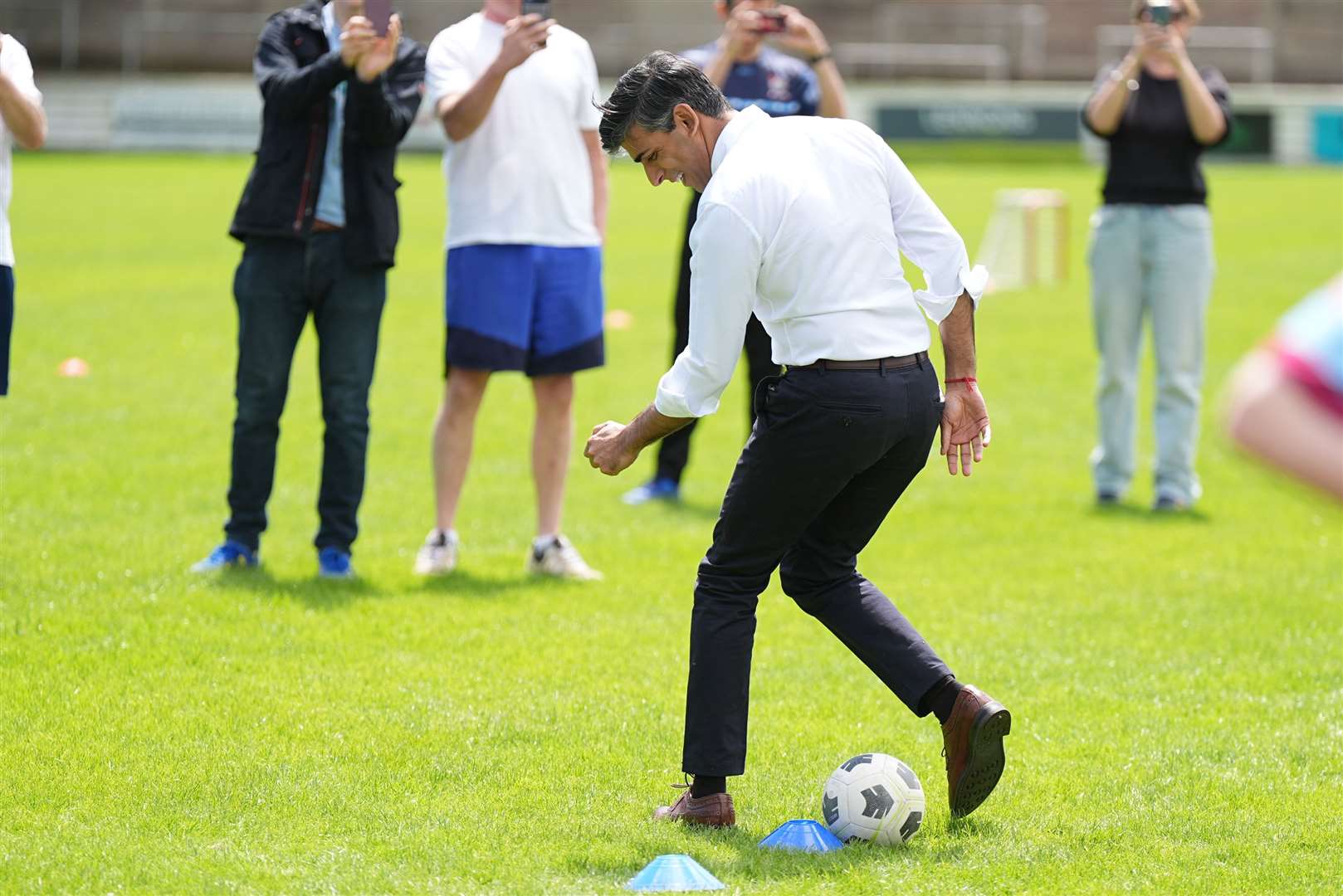 Prime Minister Rishi Sunak shows his skills during a visit to Chesham United Football Club (Aaron Chown/PA)