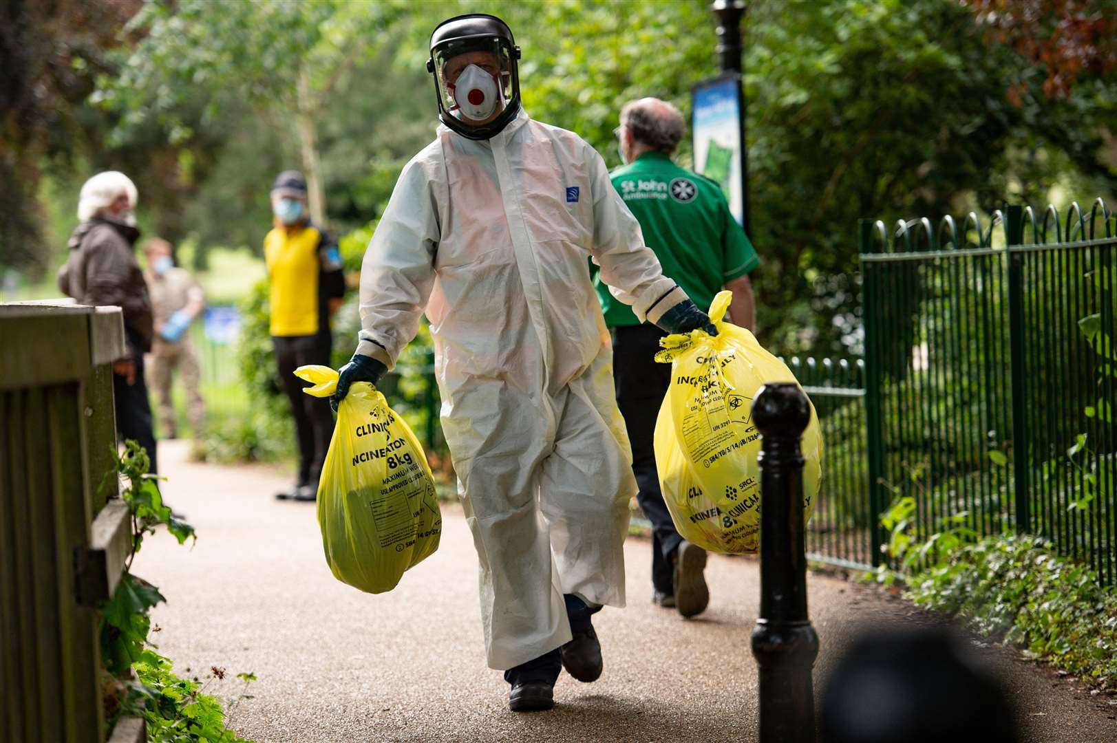 A council worker carries rubbish from a coronavirus testing centre in Leicester, after a local lockdown was imposed following a spike in coronavirus cases in the city (Jacob King/PA)