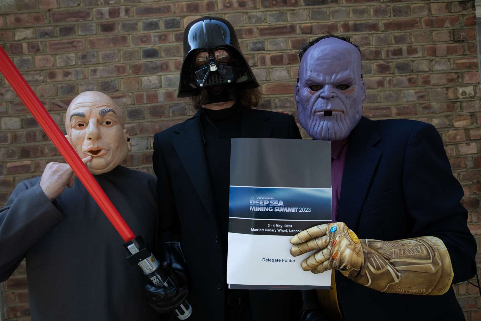 People dressed up as (left to right) Dr Evil, Darth Vader and Thanos during the Deep Sea Mining Conference at the Marriott Canary Wharf hotel in London. (Greenpeace/Jack Taylor Gotch)