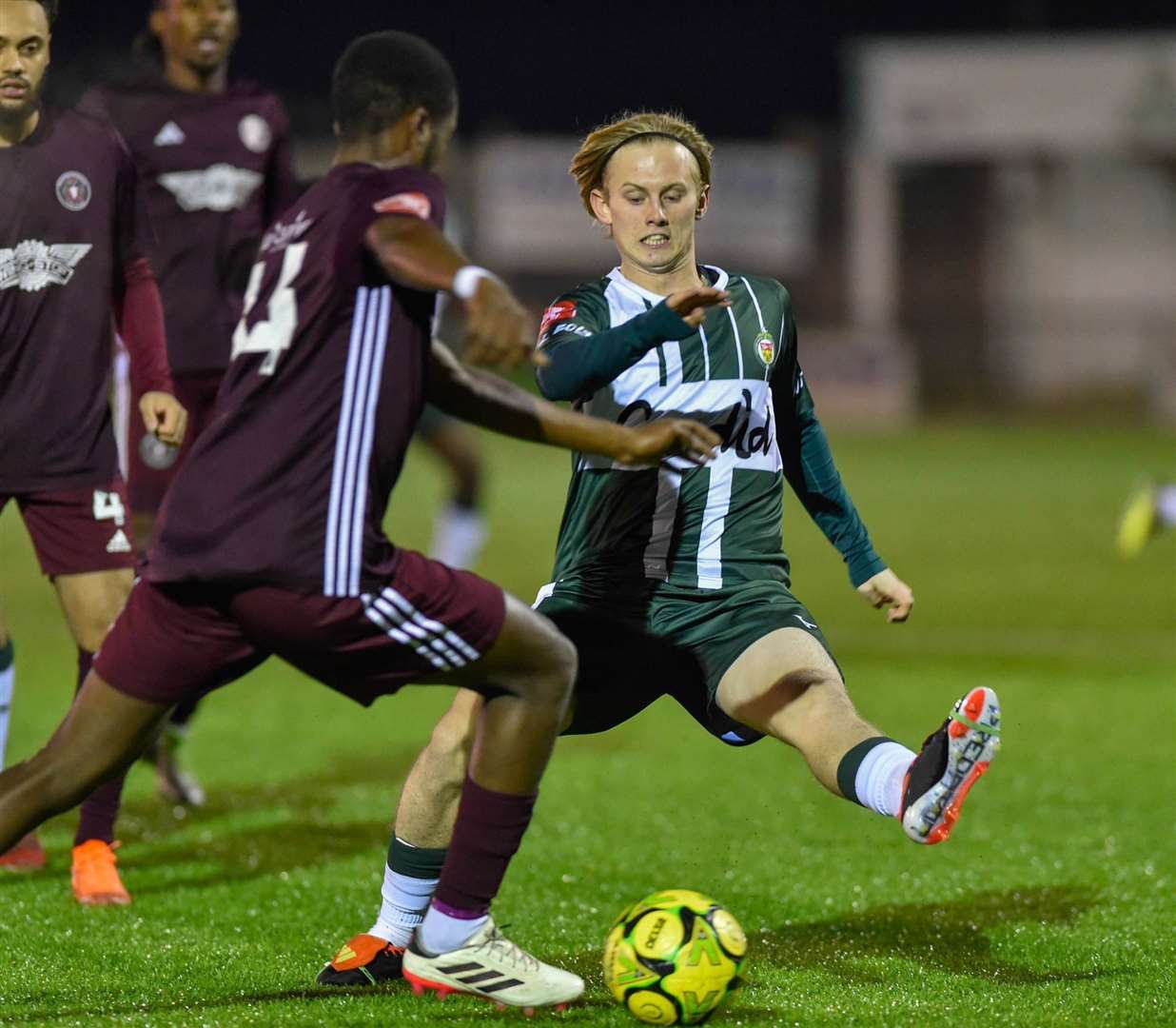 Ashford United midfielder Mikey Berry puts in a tackle against AFC Croydon. Picture: Ian Scammell