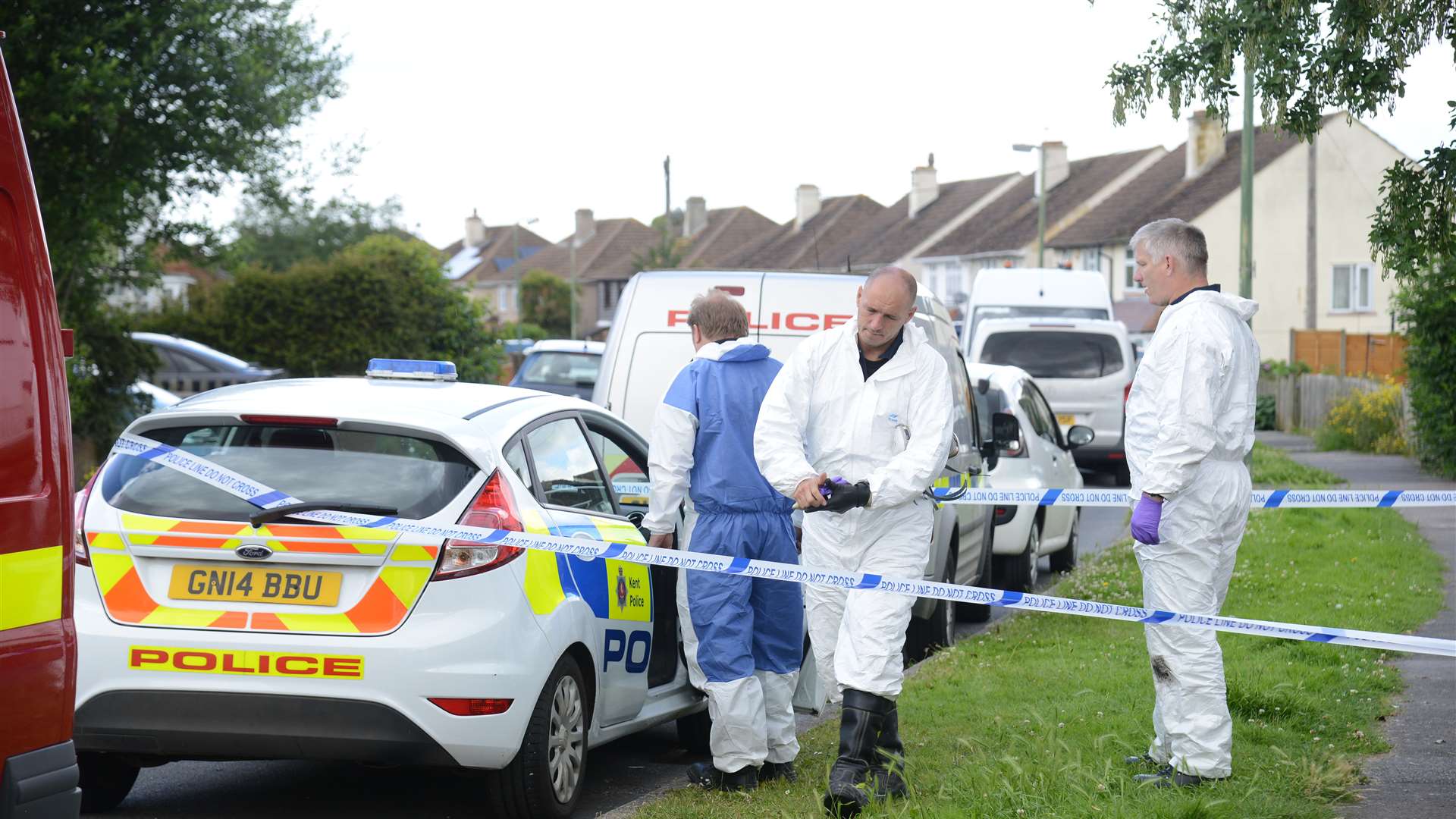 Flashback... forensic investigation teams at the scene of the fire