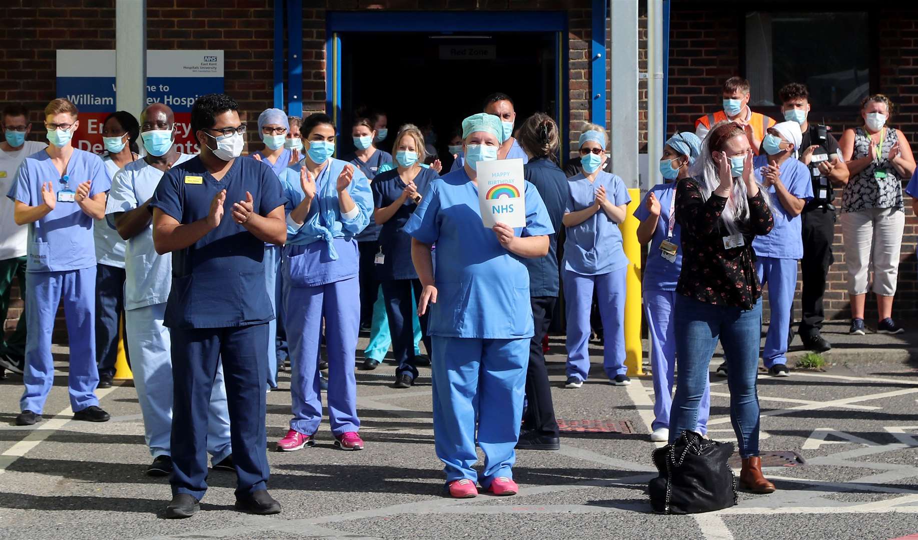 NHS staff outside the William Harvey Hospital in Ashford, Kent (Gareth Fuller/PA)