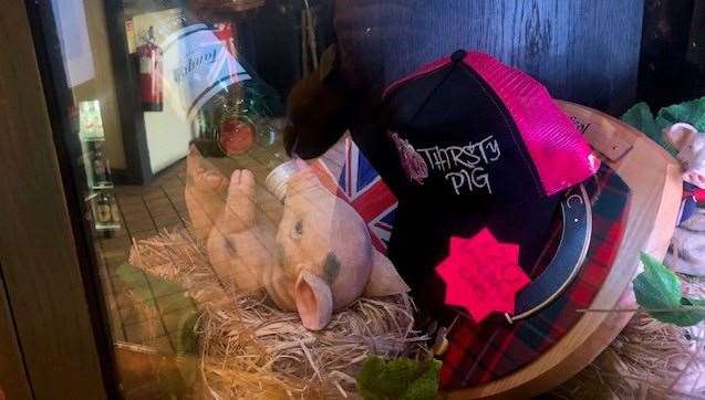 There was a varied selection of merchandise items on offer in a glass cabinet in one corner. Though I might need a couple more pints before being persuaded to part with £20 for a pink YOTP baseball cap