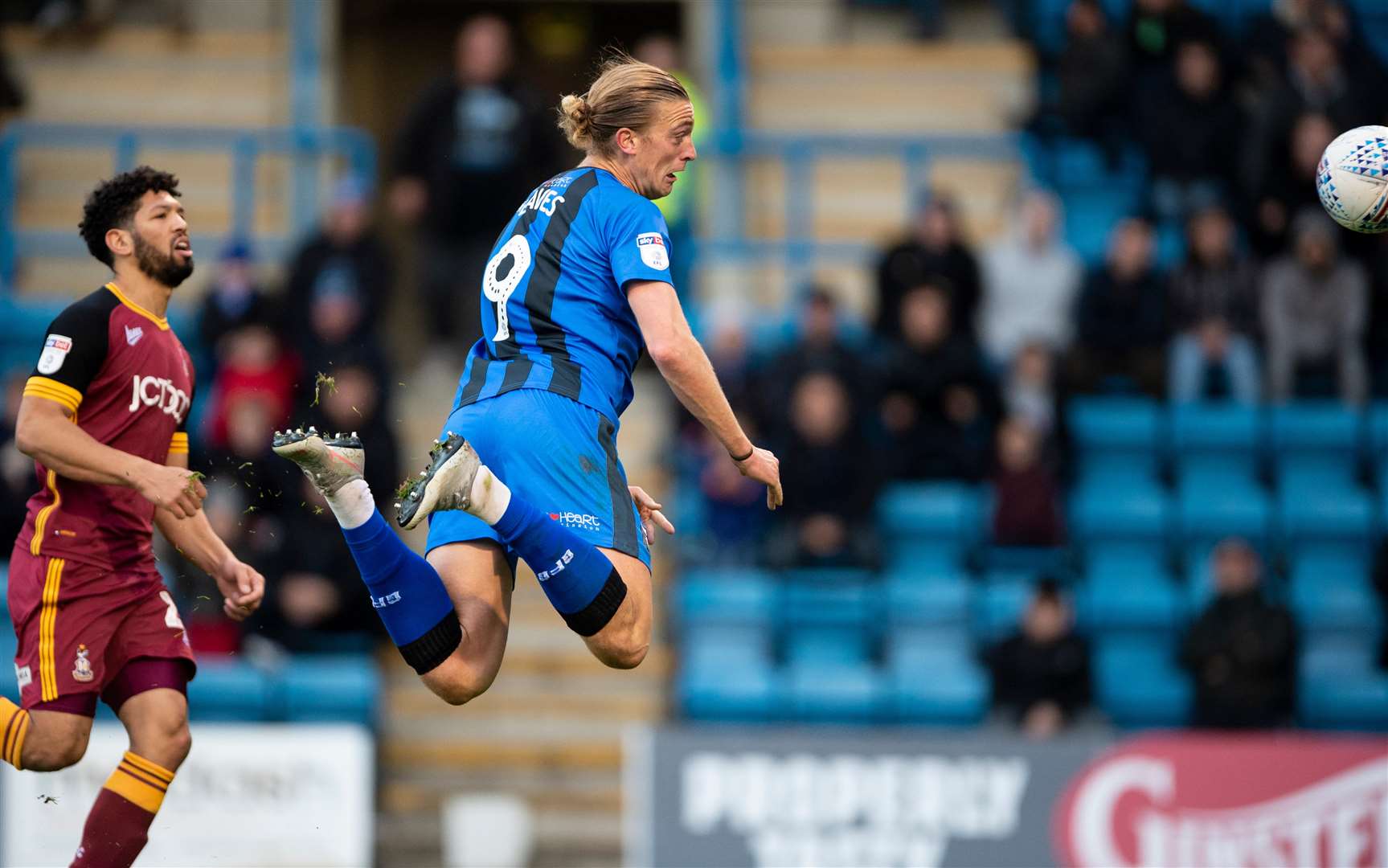 Tom Eaves heads goalwards for Gillingham against Bradford City Picture: Ady Kerry