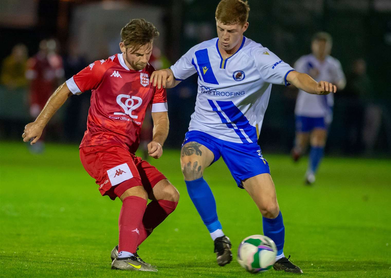 Faversham winger Ashley Miller is closed down by a home player. Picture: Ian Scammell