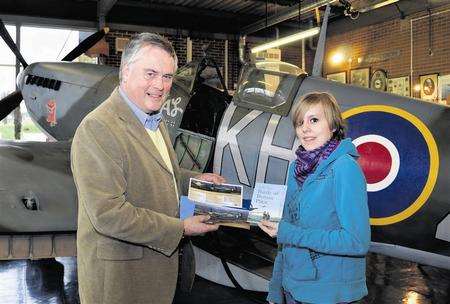 Chatham schoolgirl Louise Gordon receives her prize from Action Stations' Stephen Burt