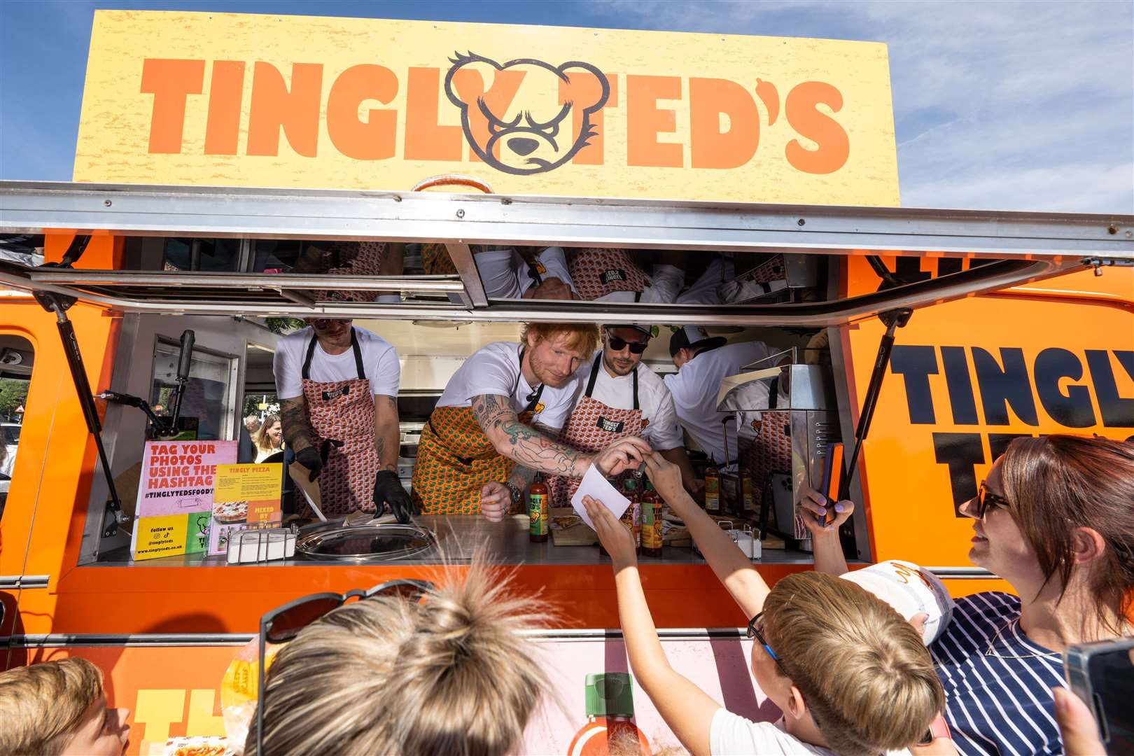 Sheeran used his hot sauce to sign autographs for fans (Jeff Spicer Media Assignments/PA)