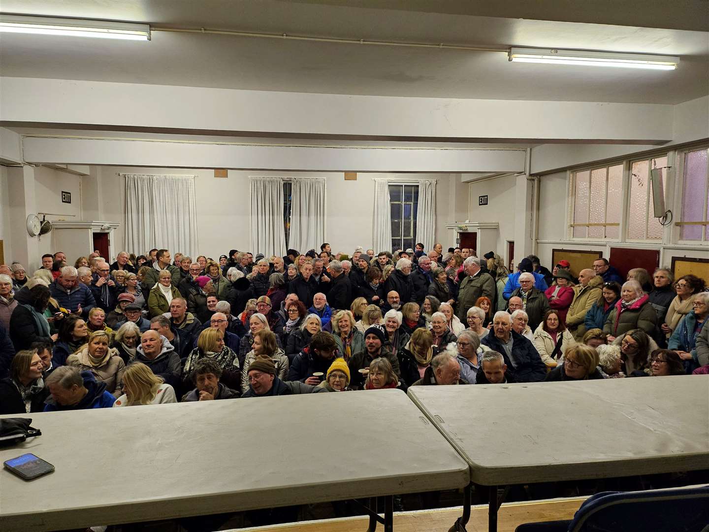 A view of the packed United Reform Church hall in Herne Bay from the perspective of the speakers