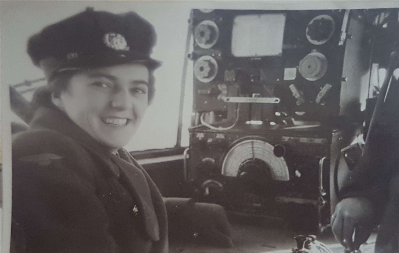 Dorothy King in her WAAF uniform in an aircraft