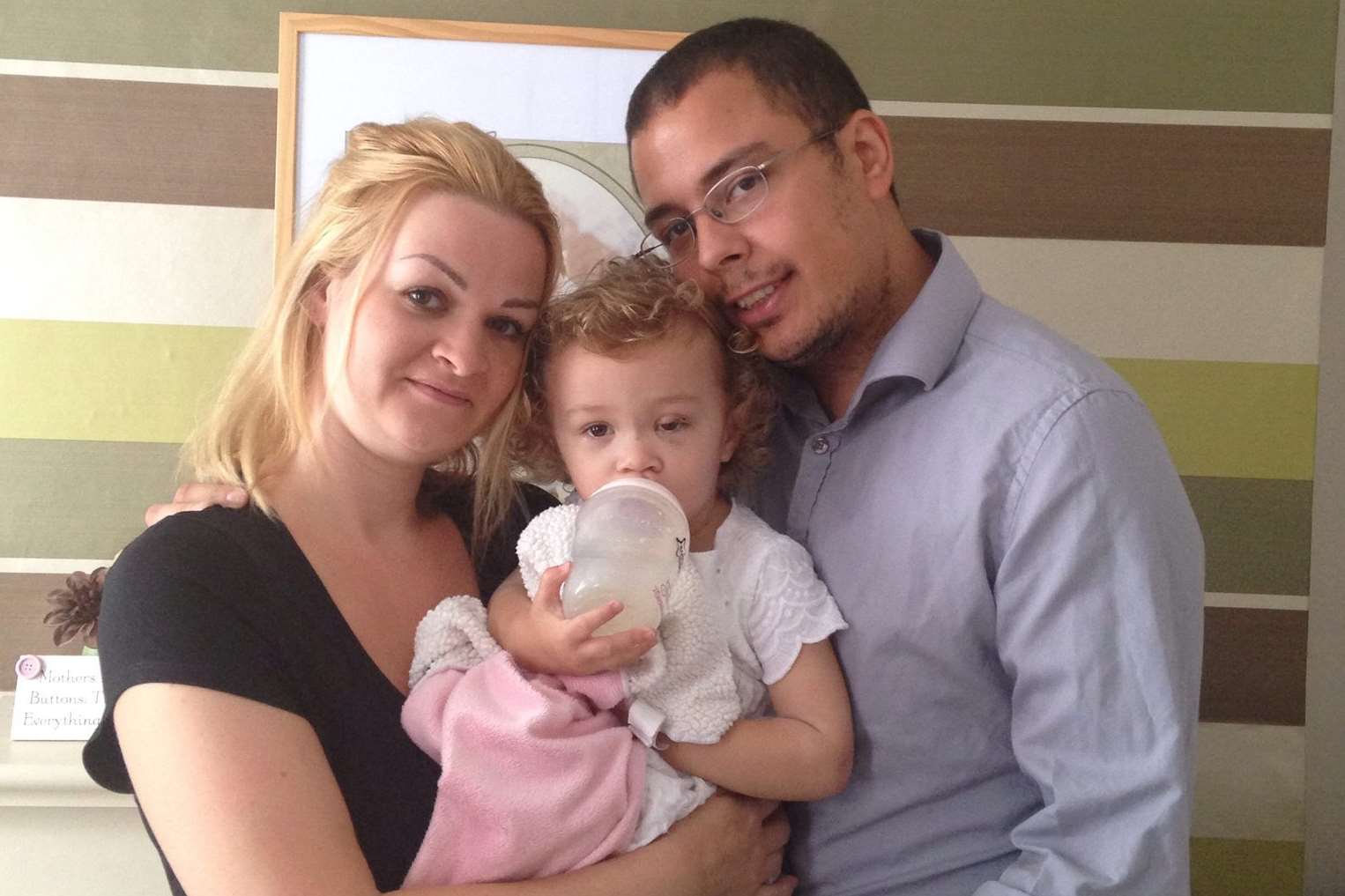 Two-year-old Poppy with mum Jenny and dad Ryan