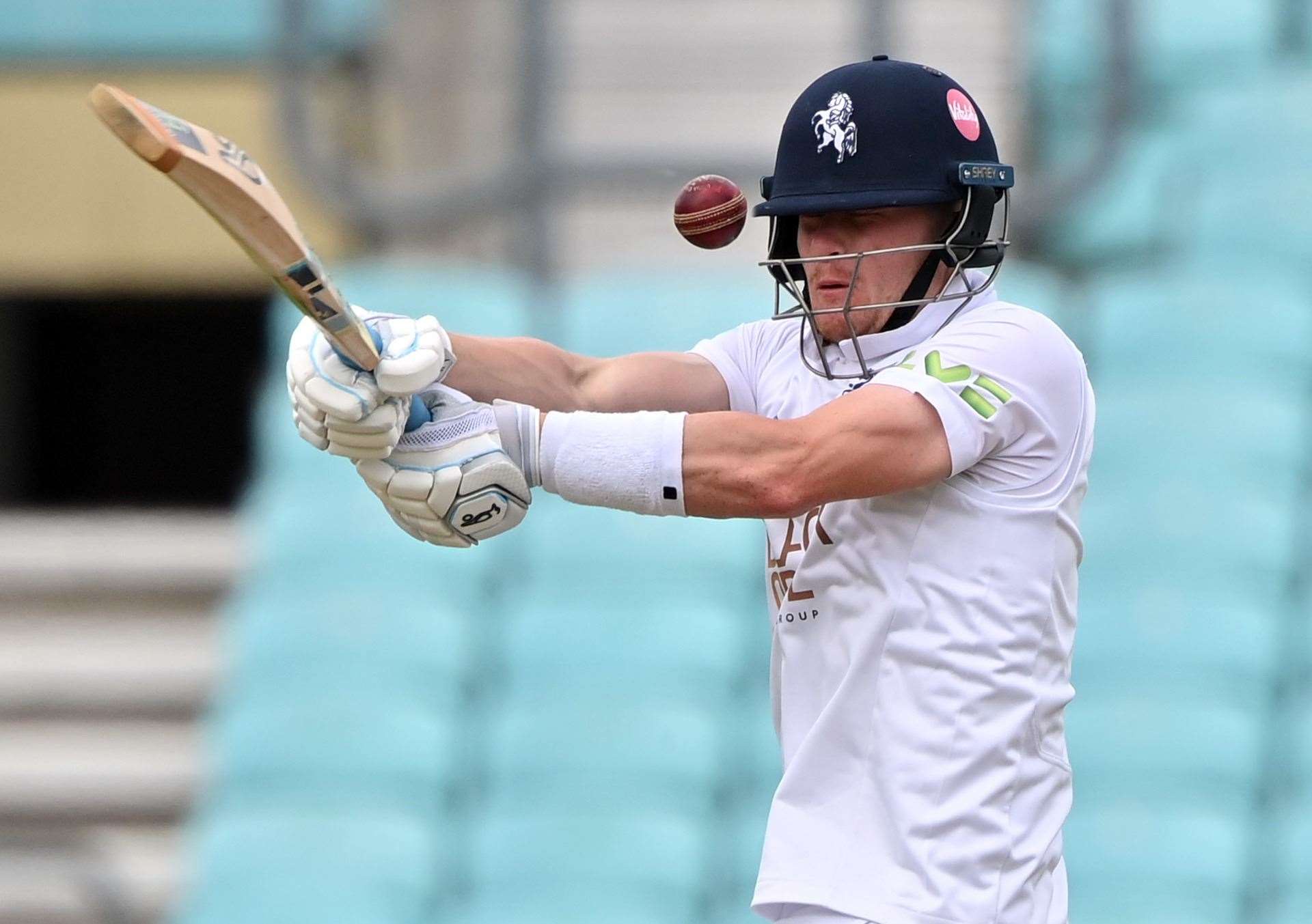 Kent's Jordan Cox is hit on helmet against Surrey. Picture: Keith Gillard