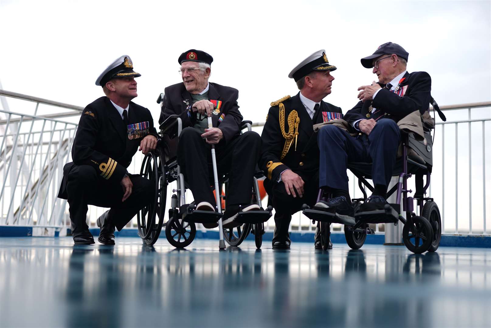 From left, Royal Navy Commander Glen Hinson, D-Day veteran Jim Grant, Royal Navy Commodore John Boyce, and D-Day veteran Charles Horne (Jordan Pettitt/PA)