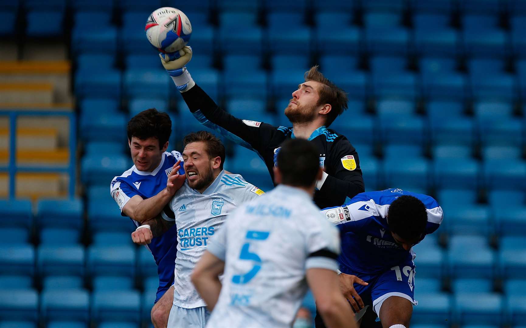 Former Gills goalkeeper Tomas Holy punches clear for Ipswich. Picture: Andy Jones